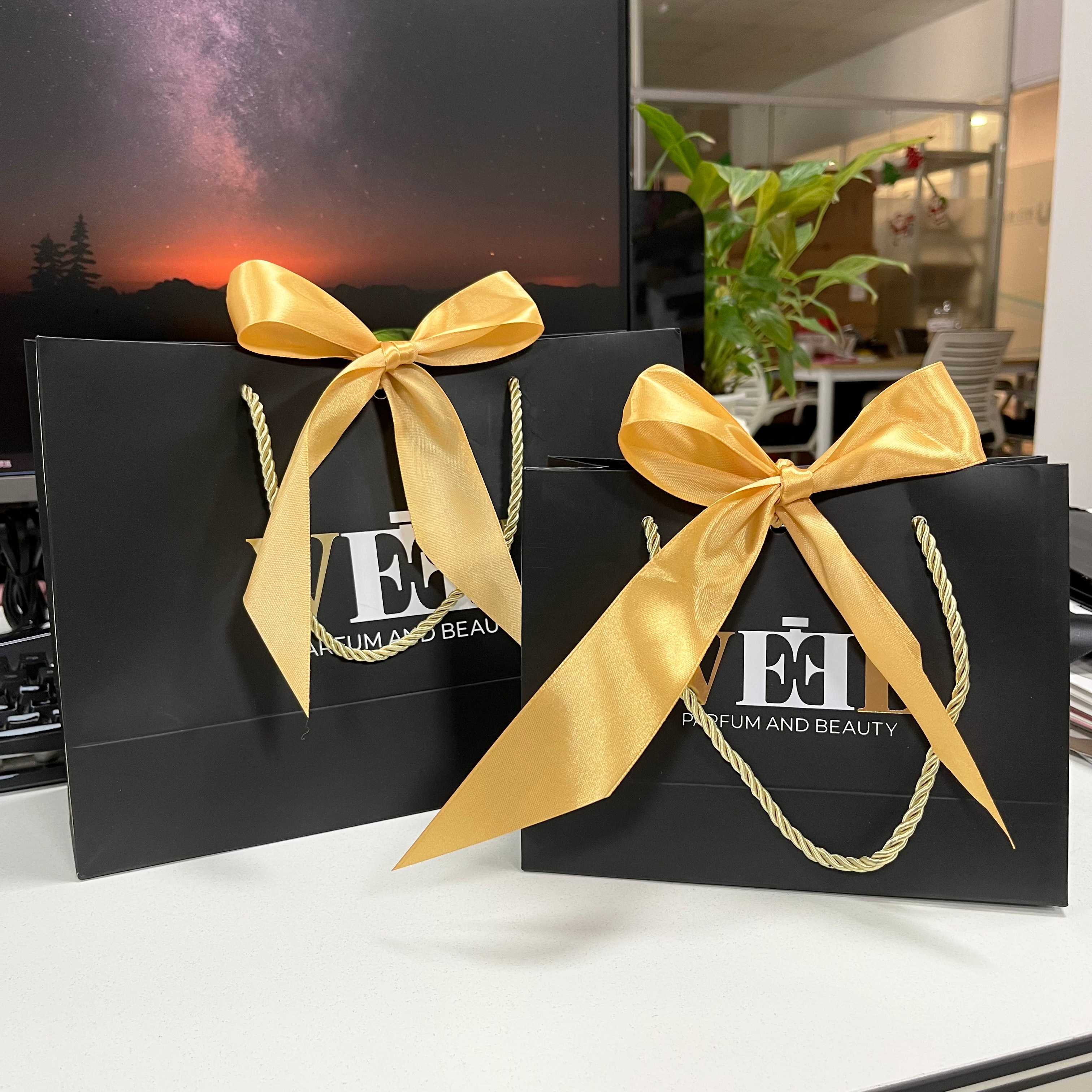 China Custom black paper bag gold foil logo paper bag for clothes paper ...